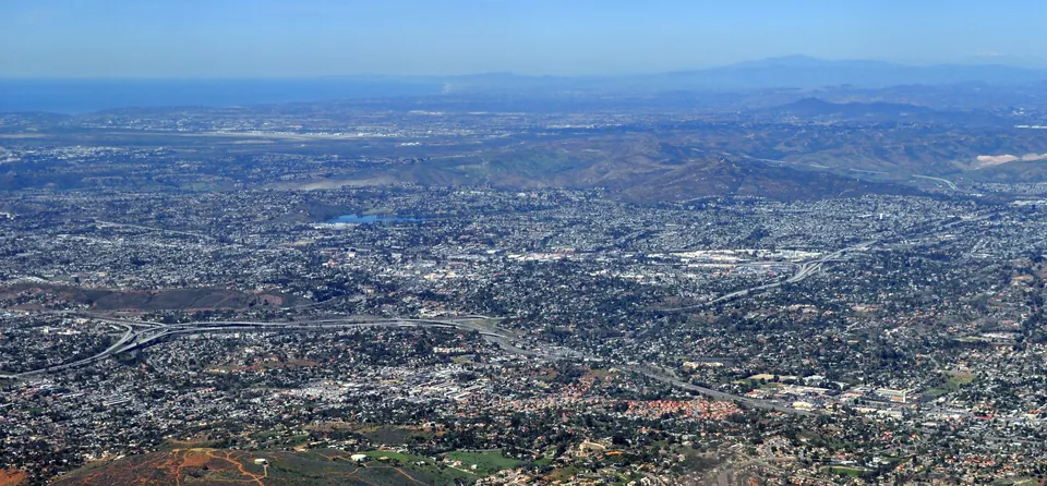 Aerial view over La Mesa’s hillside neighborhoods toward Lake Murray and the coast
